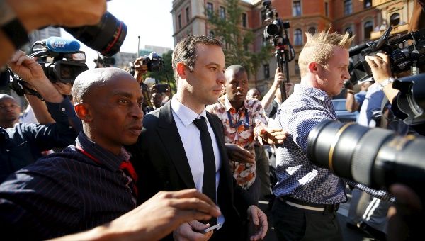 South African Olympic and Paralympic sprinter Oscar Pistorius (C) leaves the North Gauteng High Court in Pretoria after a brief appearance, April 18, 2016. 