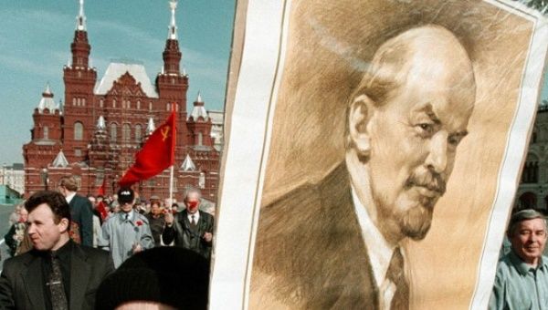 Demonstrator holds picture of Vladimir Lenin, founder of the Union of Soviet Socialist Republics