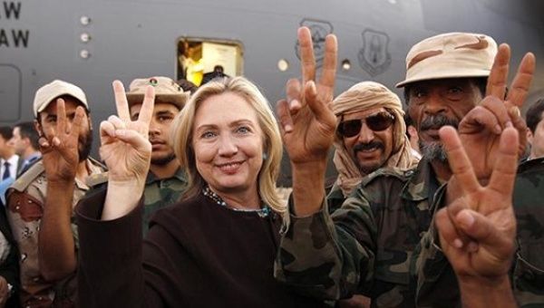 Secretary of State Hillary Clinton with Libyan soldiers upon her departure from Tripoli in Libya on October 18, 2011.