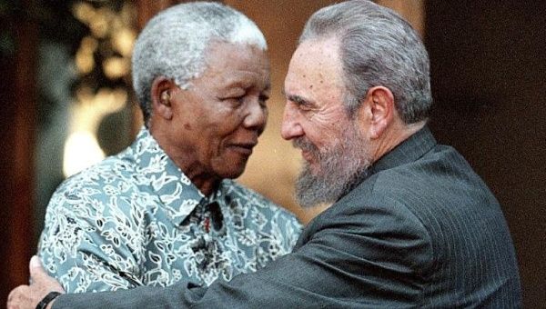 Nelson Mandela and Fidel Castro embrace.