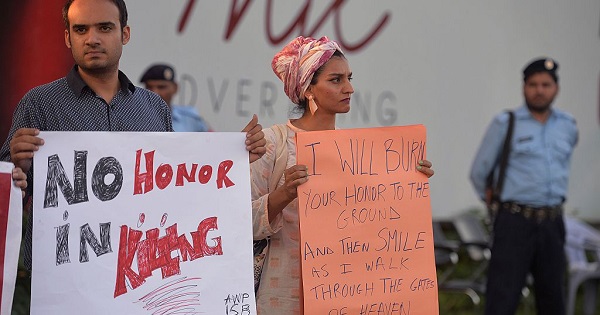 Activists carried placards during a protest in Islamabad on July 18, 2016 against the murder of Qandeel Baloch by her own brother.