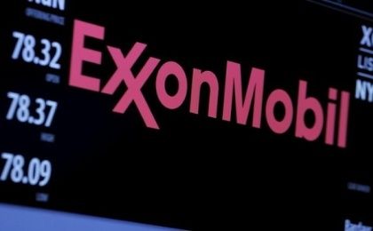 The logo of Exxon Mobil Corporation is shown on a monitor above the floor of the New York Stock Exchange in New York, Dec. 30, 2015. 