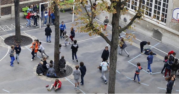 Students play outside a French school.