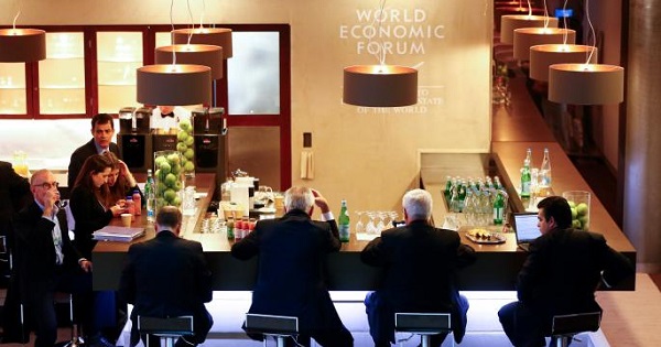 Participants sit at a bar during the annual meeting of the World Economic Forum in Davos, Switzerland Jan. 21, 2016.