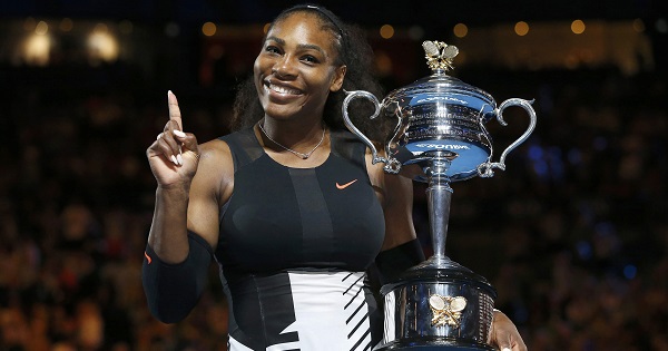 Serena Williams of the U.S. gestures while holding her trophy after winning her Women's singles final match against Venus Williams of the U.S.