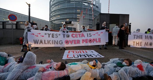 Activists surround the European Parliament building in Strasoburg, France in protest of CETA. Feb. 14, 2017