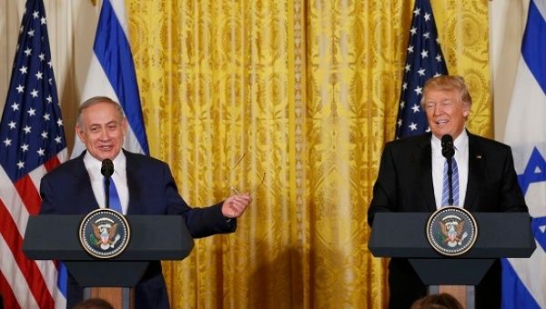 U.S. President Trump laughs with Israeli Prime Minister Netanyahu at a joint news conference at the White House in Washington.
