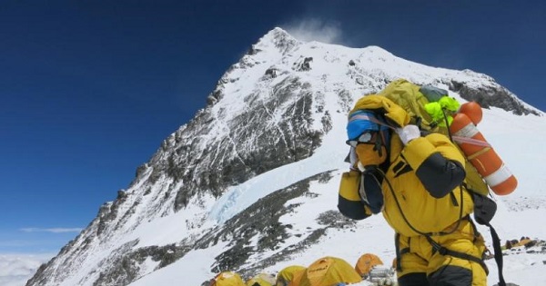 A porter carries goods at camp four at Everest.