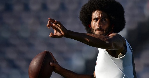Kaepernick warms up before a preseason game between the San Francisco 49ers and San Diego Chargers.