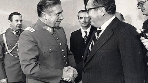 U.S. Secretary of State Henry Kissinger and Argentina's Augusto Pinochet.