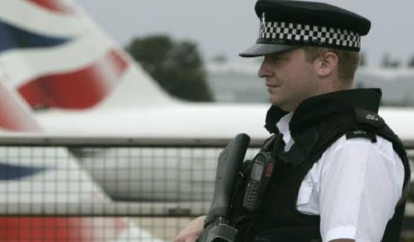 An armed policeman patrols Heathrow Airport, London.