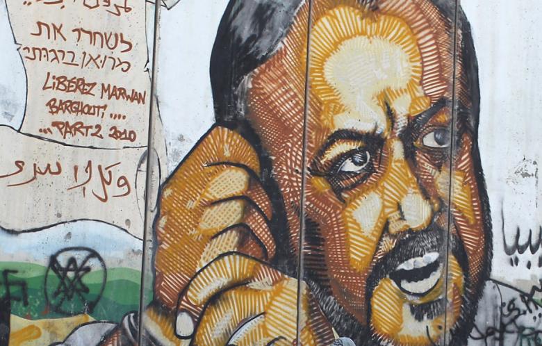 A mural painted on Israel's security wall surrounding the West Bank calls for Marwan Barghouti's release.