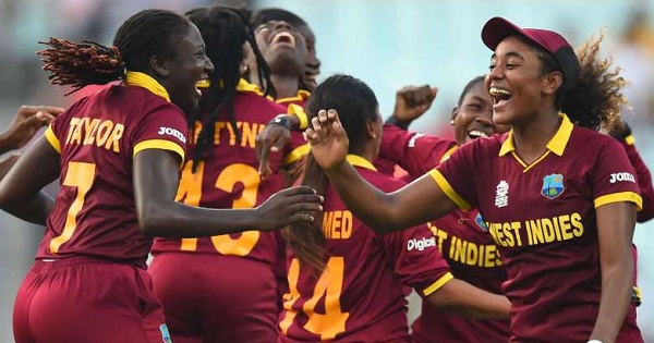 West Indies's Stafanie Taylor (left) with Hayley Matthews (right) and teammates celebrate their victory in the World T20 cricket tournament women's final match.