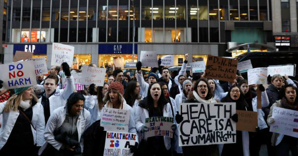 Demonstrators protest a proposed repeal of the Affordable Care Act.