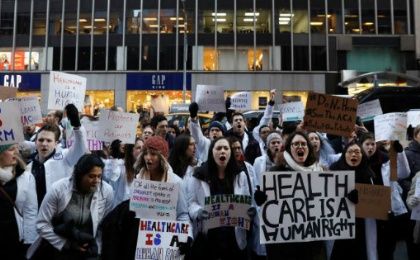 Demonstrators protest a proposed repeal of the Affordable Care Act.