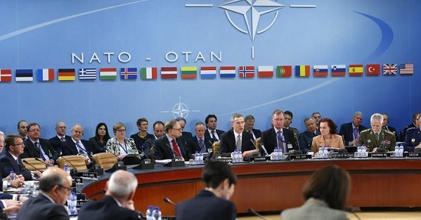 NATO Secretary General Jens Stoltenberg (C) addresses a NATO defense ministers meeting at the Alliance's headquarters in Brussels