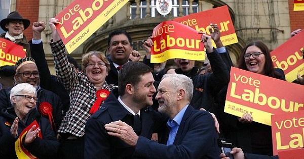 Labour leader Jeremy Corbyn pictured hugging new MP Jim McMahon as he said the result shows 