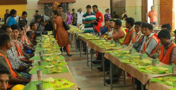 Nearly 800 migrant workers enjoy a grand traditional Kerala-style feast.