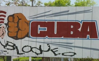 Billboard against U.S. blockade of Cuba.