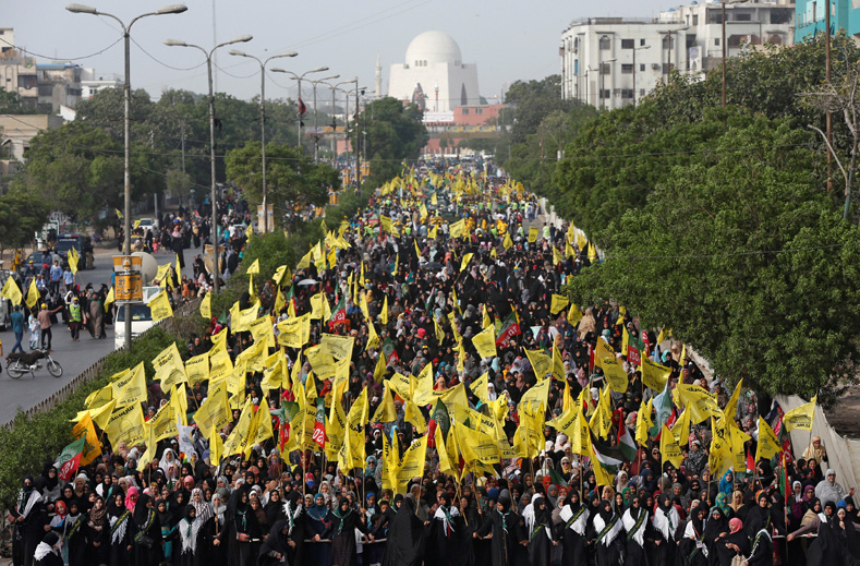 Shi'ite Muslim supporters of the Imamia Student Organization (ISO) hold flags, as they walk in a rally marking the annual al-Quds Day, or Jerusalem Day during the Muslim holy month of Ramadan in Karachi, Pakistan June 23, 2017. 