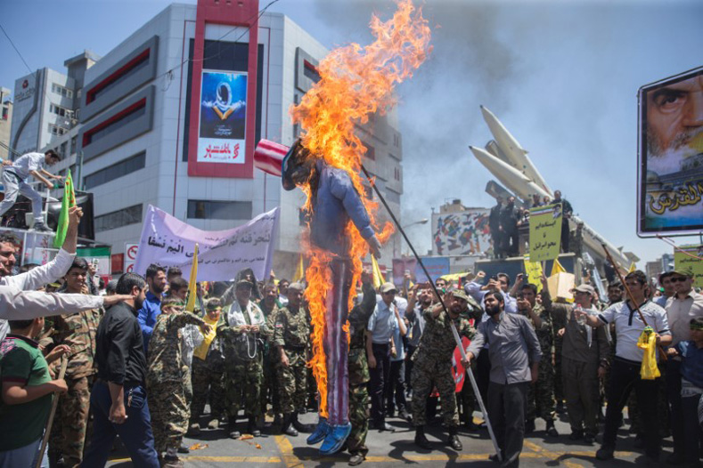A scarecrow model is set on fire by Iranian demonstratorson during the annual pro-Palestinian rally marking Al-Quds Day in Tehran, Iran, June 23, 2017.