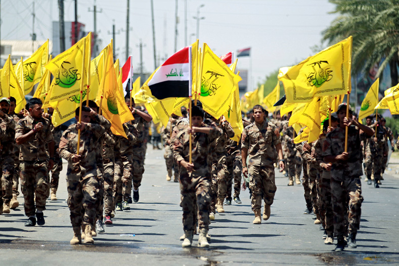 Iraqi Shi'ite Muslims from Hashid Shaabi (Popular Mobilization) march during a parade marking the annual al-Quds Day, or Jerusalem Day, in Baghdad, Iraq June 23, 2017.