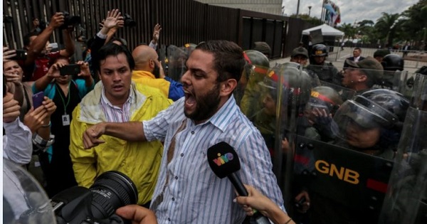 Opposition leader Juan Requesen protesting in front of Venezuela's Supreme Court.