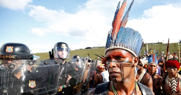 Brazilian Indigenous people take part in a demonstration against the violation of their rights in Brasilia.