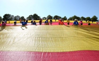 People assemble a giant Catalan separatist flag during a pro-independence rally in Sant Cugat del Valles, Spain, on July 8, 2017.
