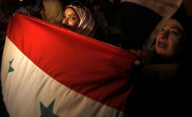 Syrian protesters living in Egypt take part in a demonstration in support of President Bashar al-Assad.