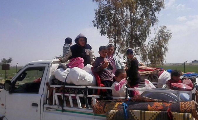 Syrian refugees flee the city of Raqqa.