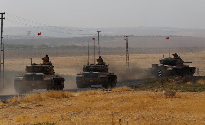 Turkish army tanks drive towards to the border in Karkamis on the Turkish-Syrian border in the southeastern Gaziantep province, Turkey, August 25, 2016.