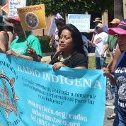 Radio Indigena community volunteers take part in workers' rights march.