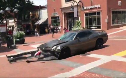 James Alex Fields Jr. quickly drives his sports car in reverse after ramming it into demonstrators protesting a white suprmeacist rally.