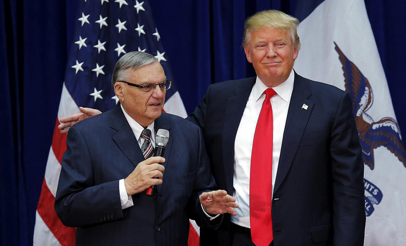 Republican presidential candidate Donald Trump is joined onstage by then-Sheriff Joe Arpaio at a campaign rally in Marshalltown, Iowa, Jan. 26, 2016.