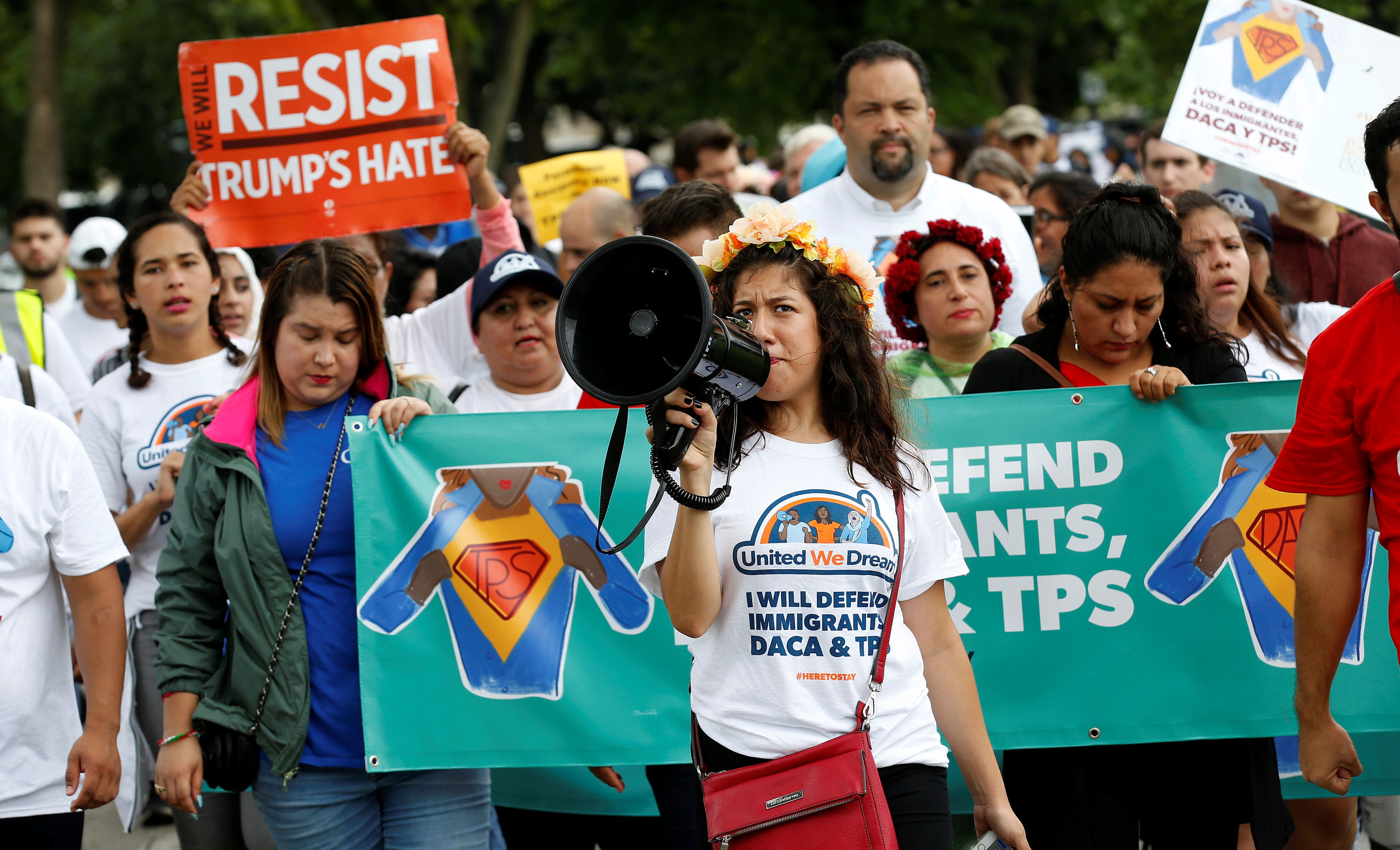 Demonstrators carrying signs march during a rally in Washington, U.S., August 15, 2017.