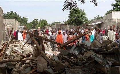 Residents gather at the scene of a bombing attack in Maiduguri, northeast Nigeria on July 17, 2017. 