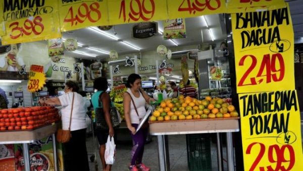 People shop in a grocery store in the city of Rio de Janeiro.