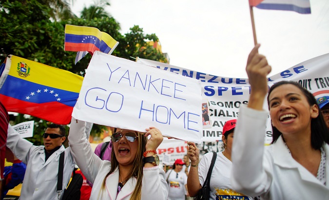 People shout slogans during a march to express support for Venezuela in Havana, Cuba, August 25, 2017.