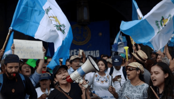 Demonstrators protest against Guatemalan President Jimmy Morales in front of the National Palace in Guatemala City, Guatemala, August 27, 2017.