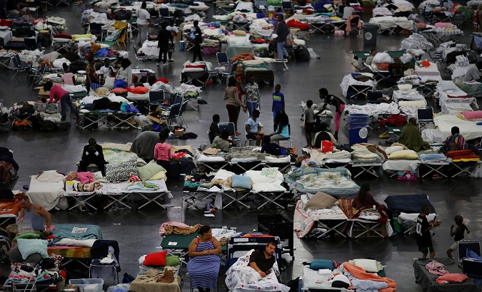 Evacuees affected by Tropical Storm Harvey take shelter at the George R. Brown Convention Center in downtown Houston, Texas, U.S., August 31, 2017