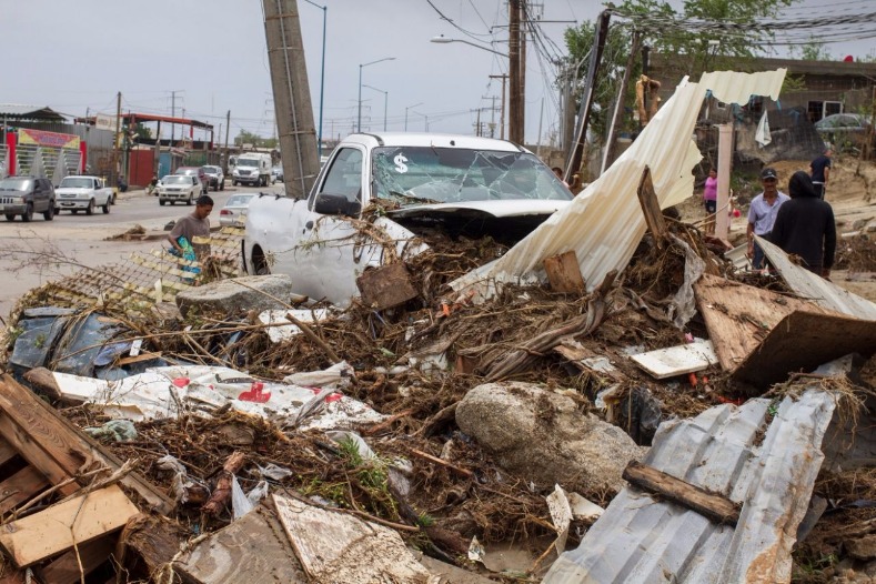 A truck sits among debris in the aftermath of Tropical Storm Lidia in Los Cabos, Mexico.