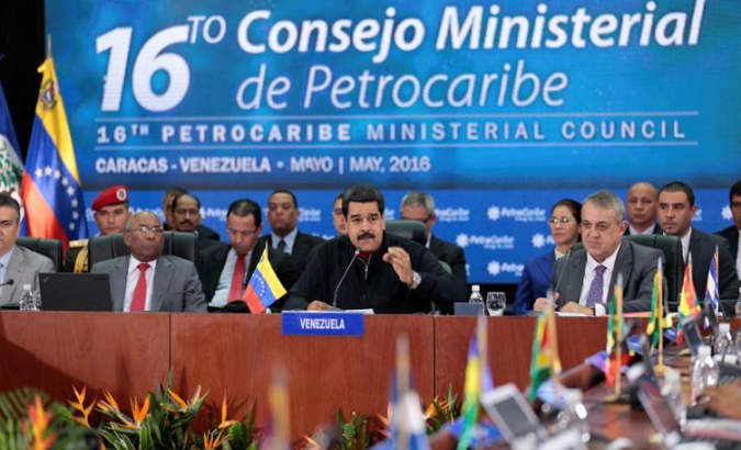 Venezuela's President Nicolas Maduro (C) speaks during the 16th PetroCaribe Ministerial Council in Caracas May 27, 2016.