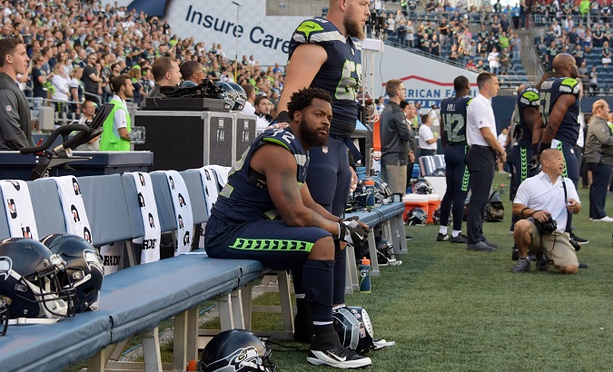 Seattle Seahawks' defensive end Michael Bennett sits out the national anthem on Aug 25, 2017.