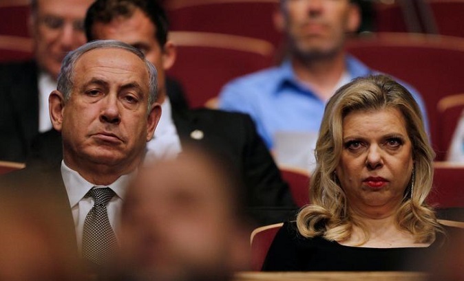 Israeli Prime Minister Benjamin Netanyahu (R) with his wife Sara Netanyahu (L) are both in legal heat for alleged fraud.
