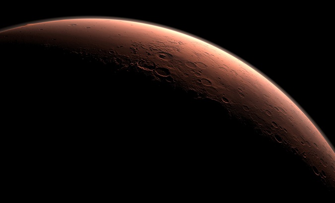 This computer-generated view depicts part of Mars at the boundary between darkness and daylight.