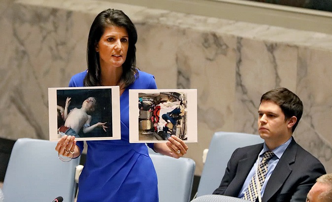 U.S. ambassador Nikki Haley speaking to the United Nations in April, holding photos and levying accusations that Syria was responsible for the chemical weapons released that killed over 80.