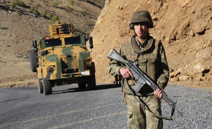 Turkish soldiers patrol a road near Uludere in the Sirnak province, southeastern Turkey.