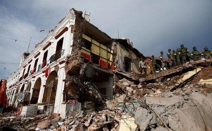 Soldiers work to remove the debris of a house destroyed in an earthquake in Juchitan, Mexico, on September 8, 2017. 
