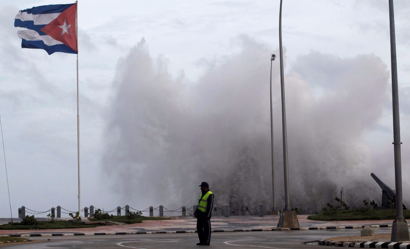 A police officer stands on the seafront boulevard El Malecon ahead of the passing of Hurricane Irma, in Havana, Cuba September 9, 2017.